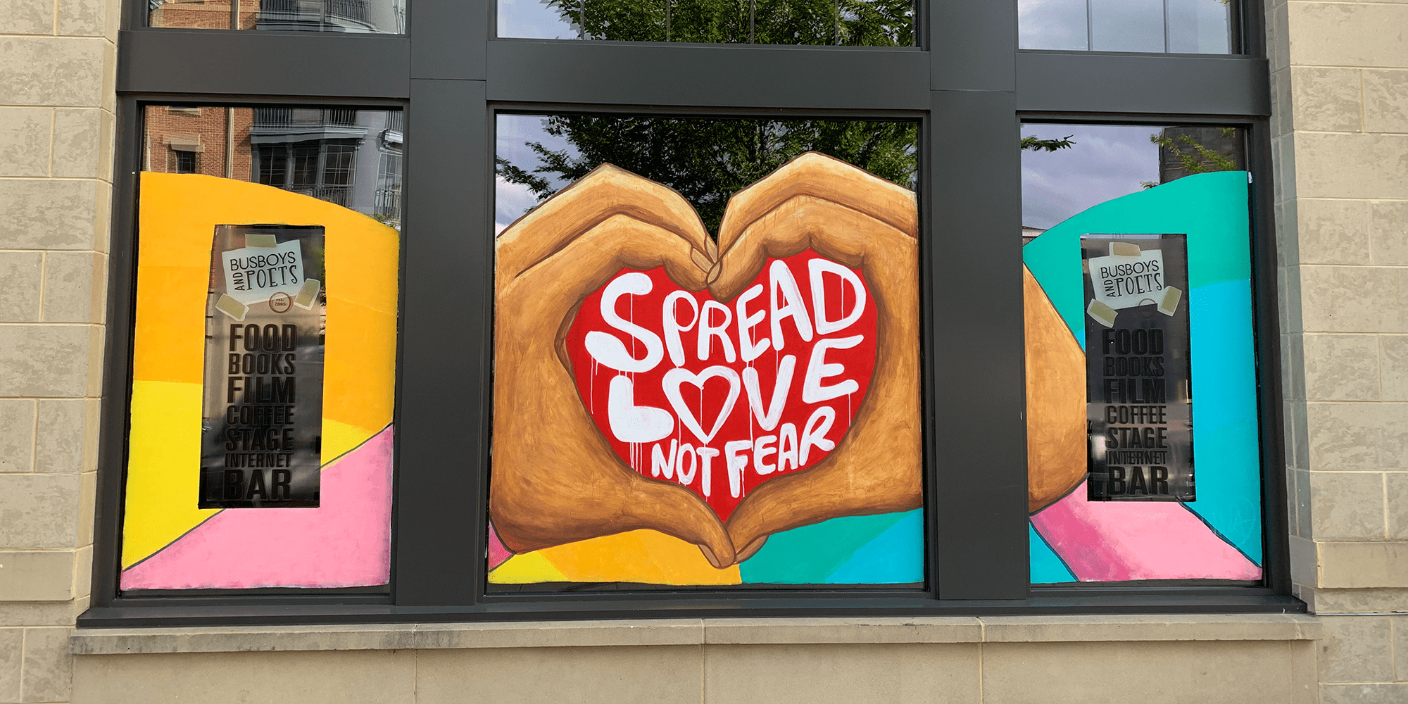 Photos of a #PaintTheStoreFronts mural by Mia Duvall